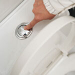 hand flushing toilet